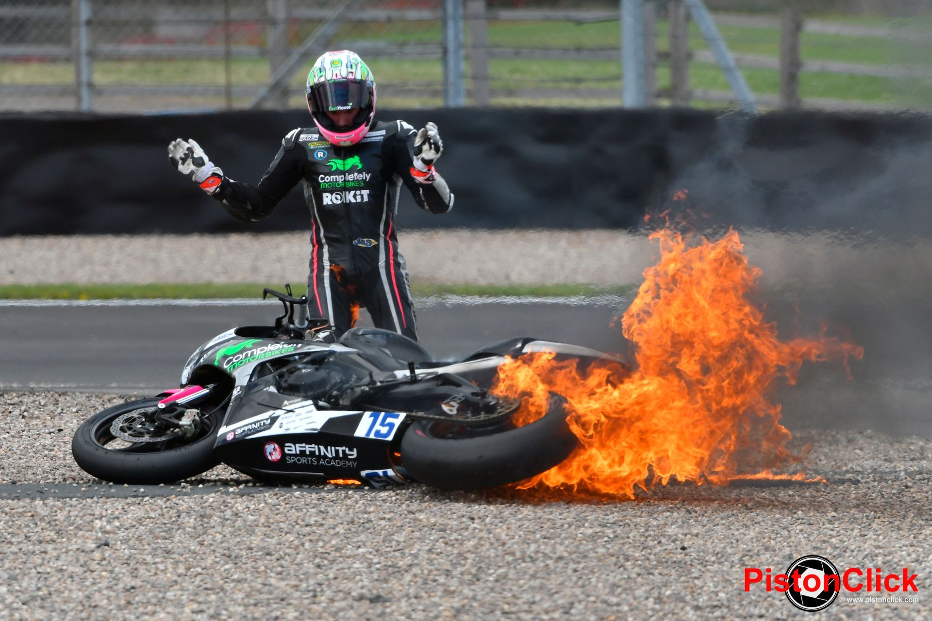 Safety Marshalls putting out a motorcycle fire