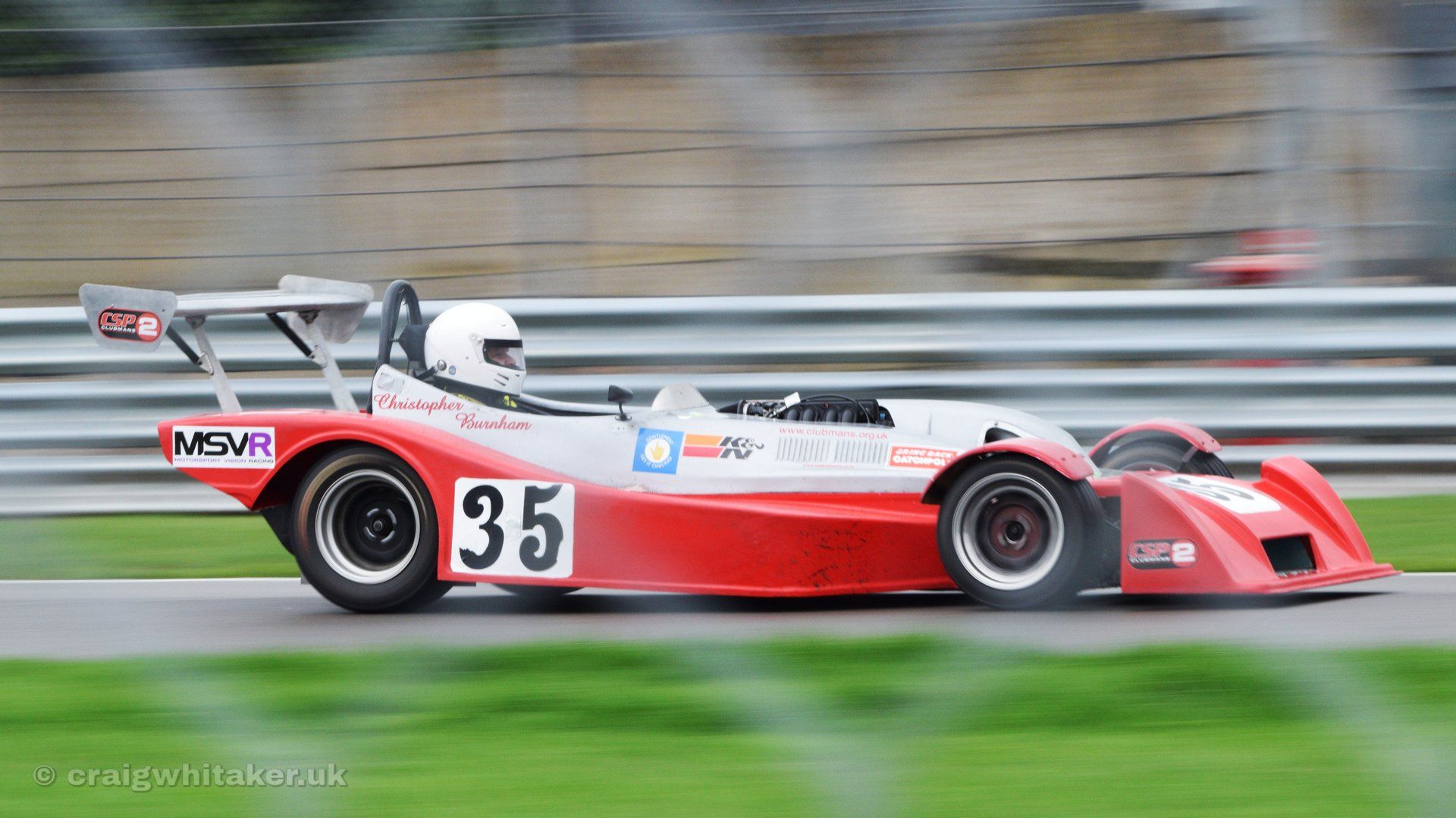 A guide to taking motorsports photography through Safety Fencing.