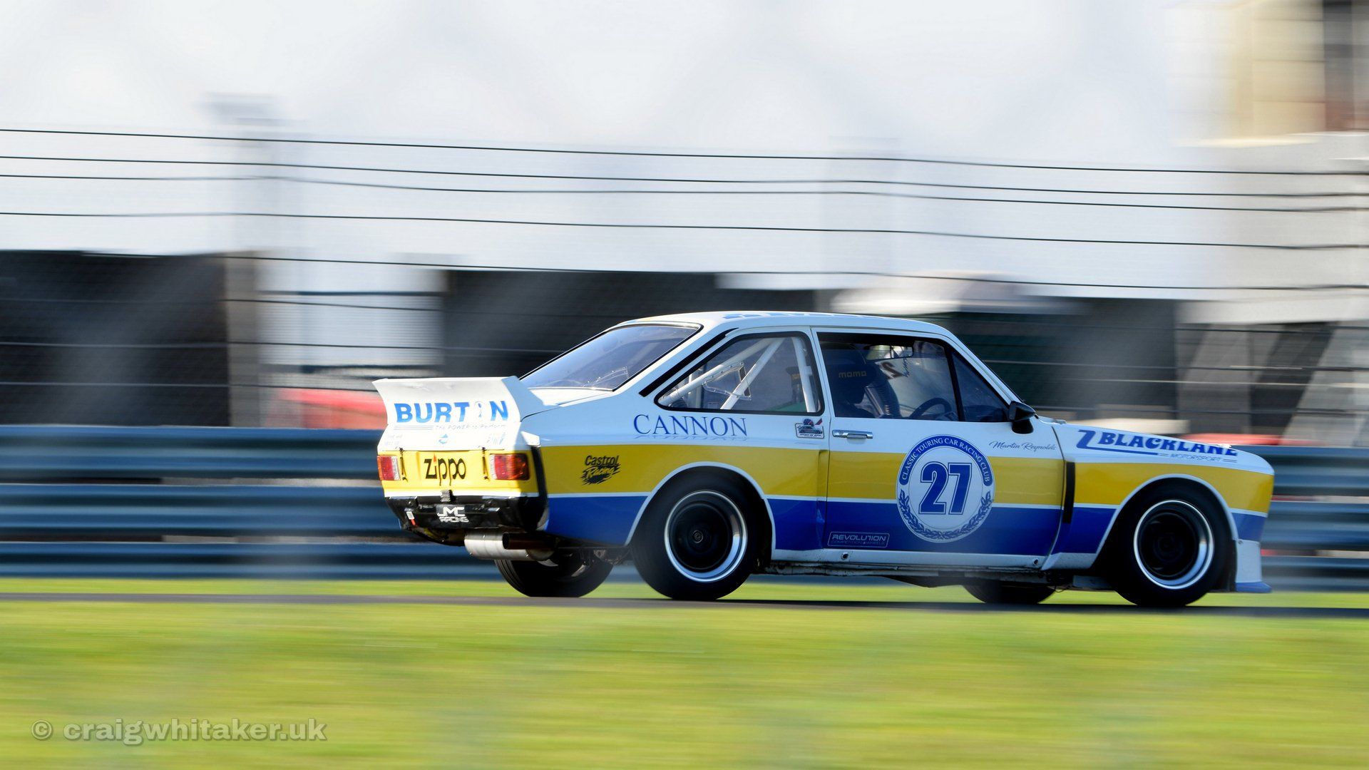 A guide to taking motorsports photography through Safety Fencing.