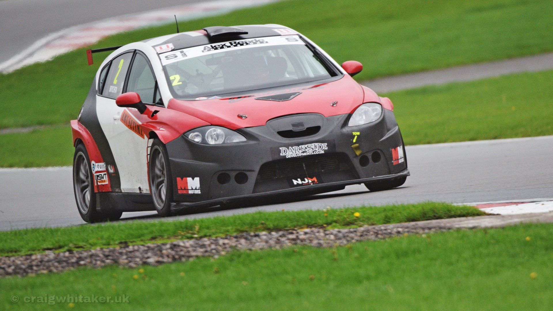 A guide to taking motorsports photography through Safety Fencing.