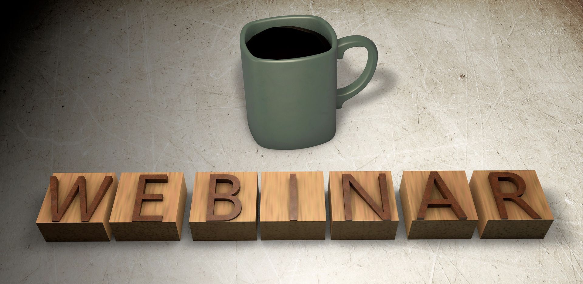 Webinar. Eine Tasse steht im Hintergrund.