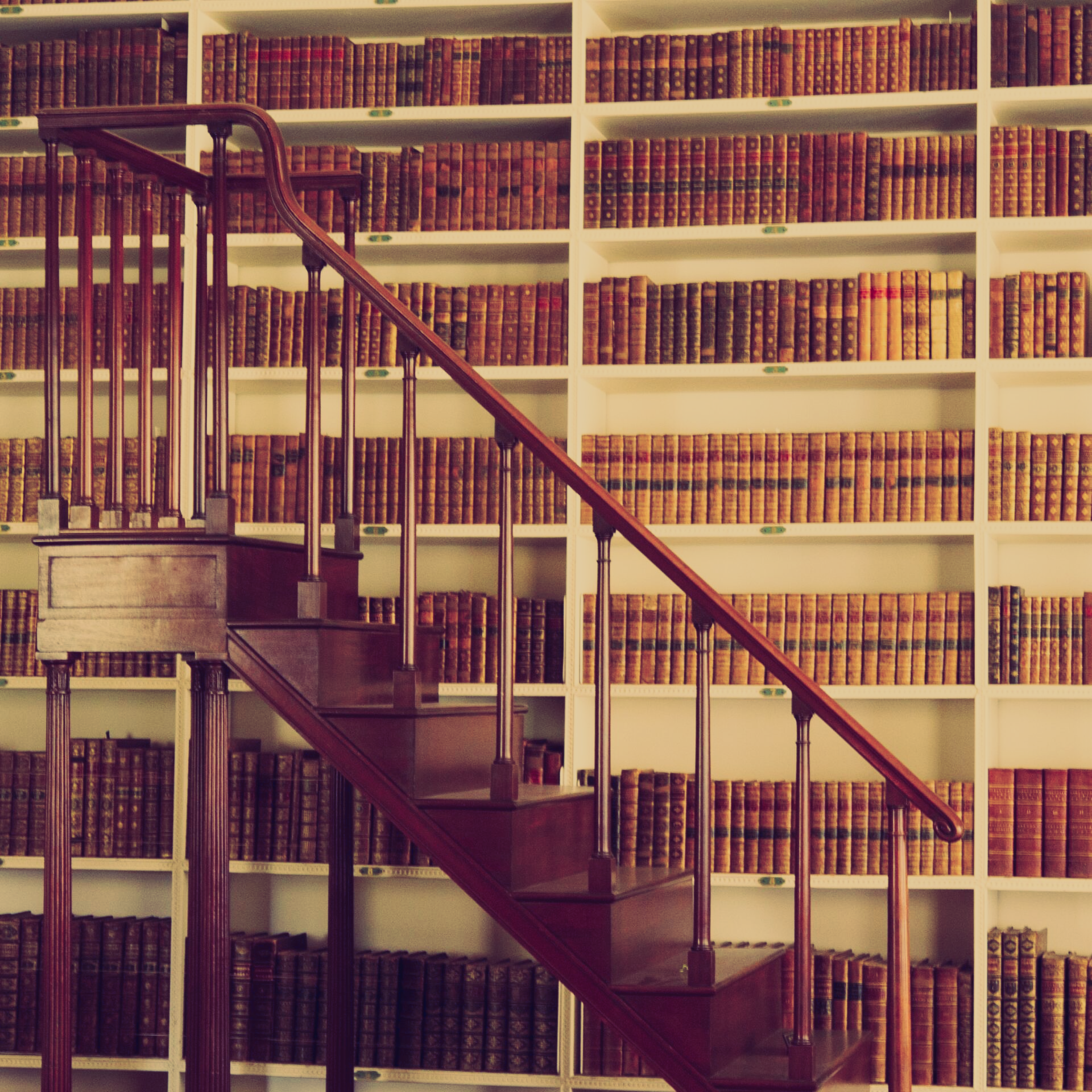 Traditional library with wooden library steps, representing Tax and Trusts knowledge