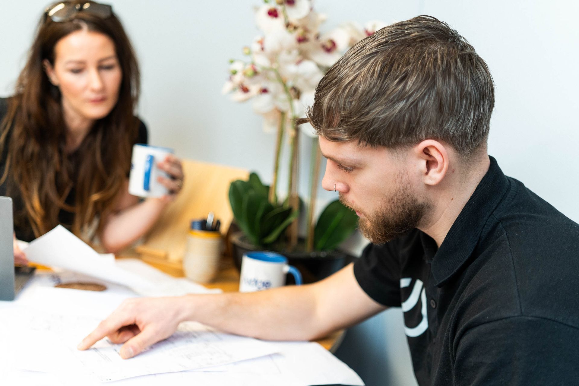 free quote visit, electrician looking at plans for electrical works