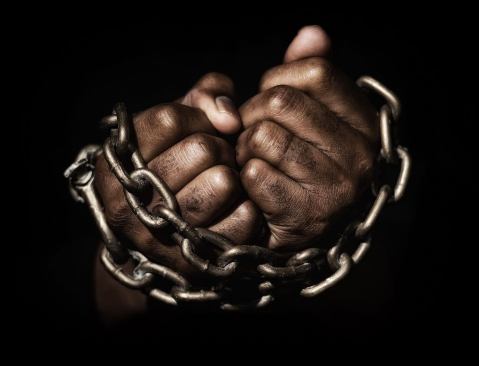 Shackled man