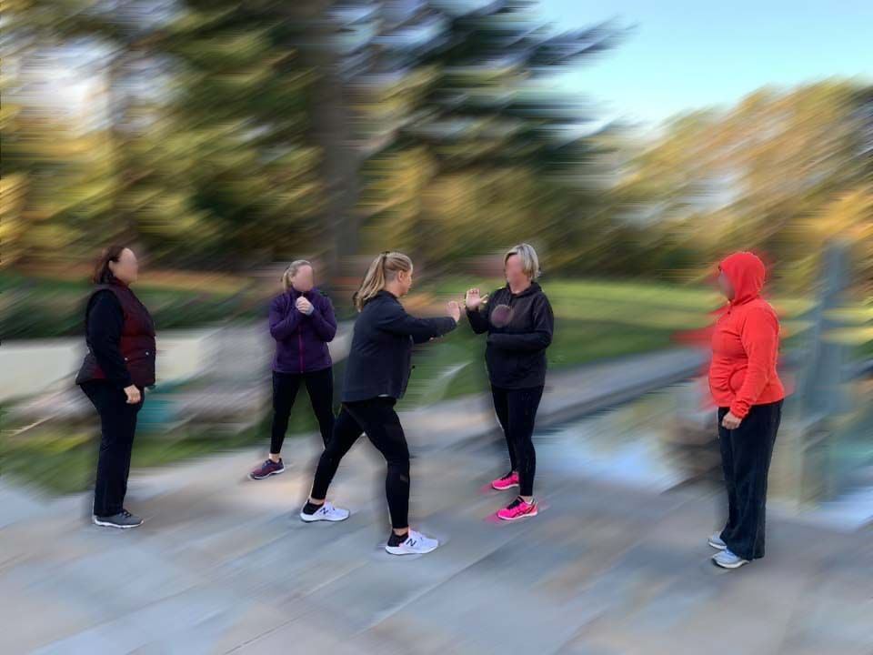 Group of women practicing self-defense outside with second nature self defense