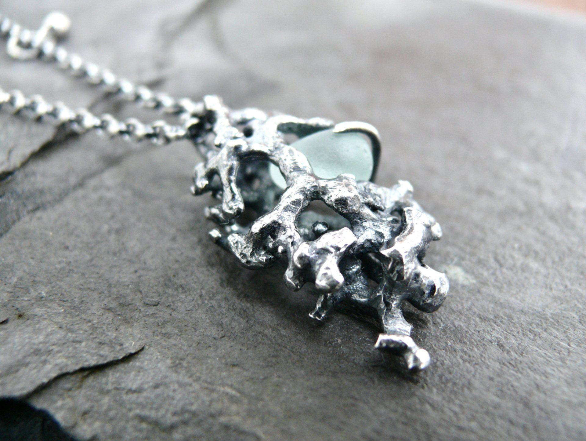 scottish sea glass necklace made in scotland. Seafoam glass with coral design cast from arisaig coral