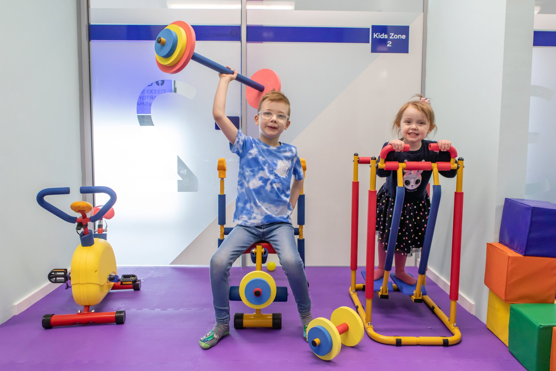 Children using toy gym equipment in Smart Gym Glasgow's creche facilities