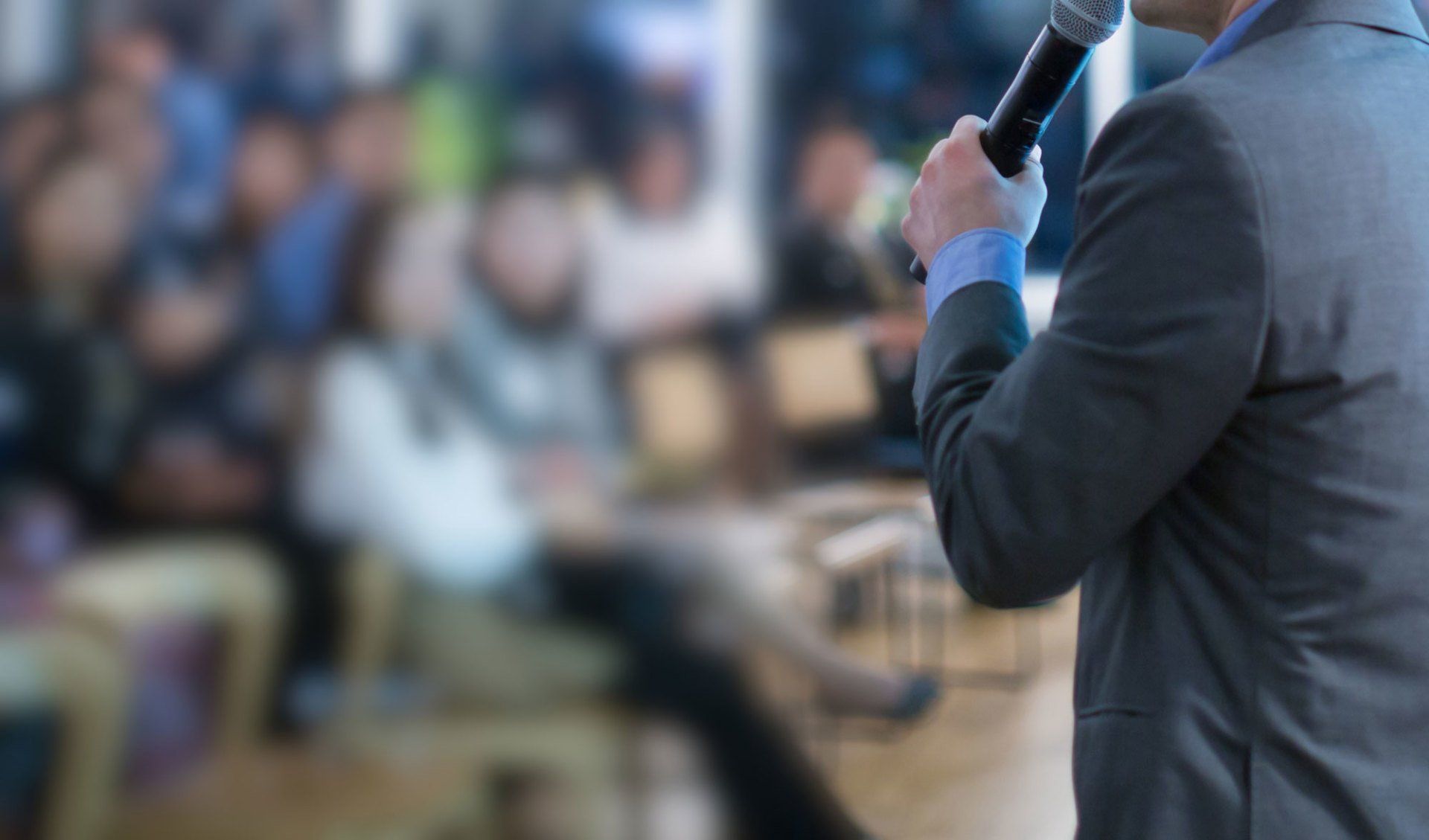 People sitting and listening to a speaker