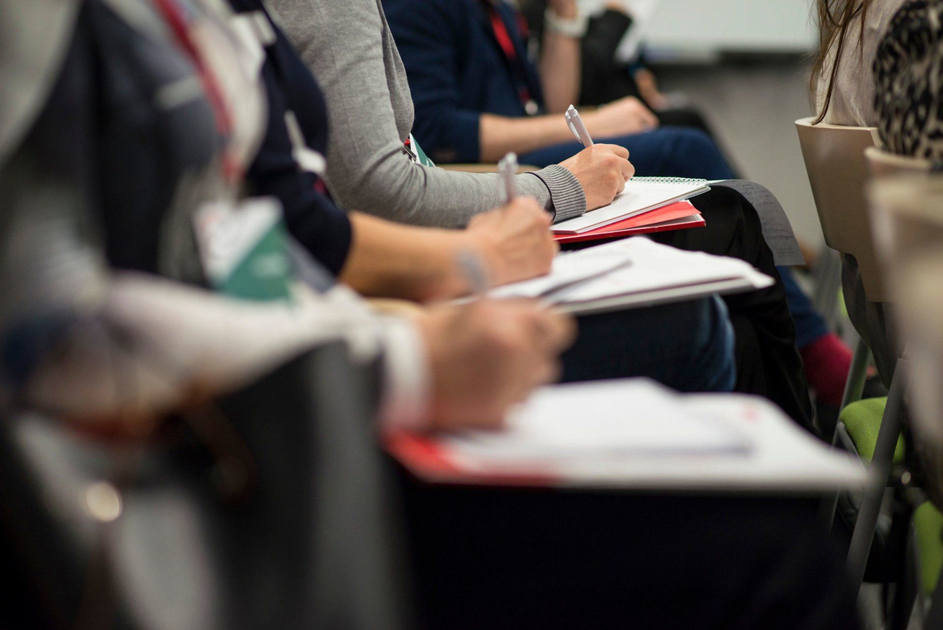 People writing information down