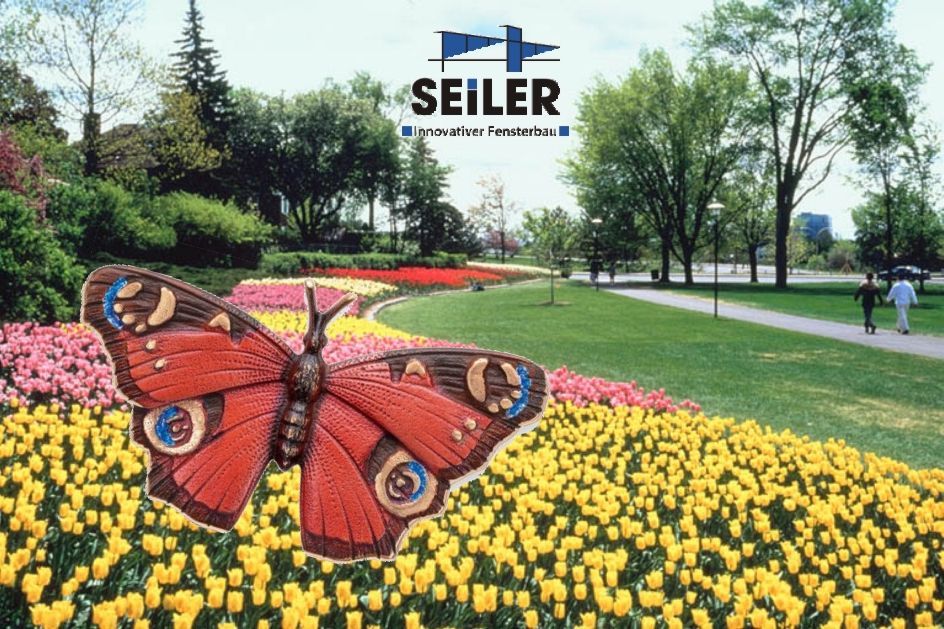 Parklandschaft mit tulpen und einem Schmetterling