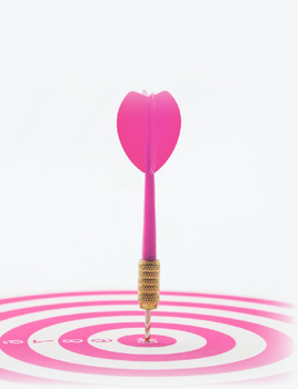 Image of a pink dart arrow hitting the bullseye
