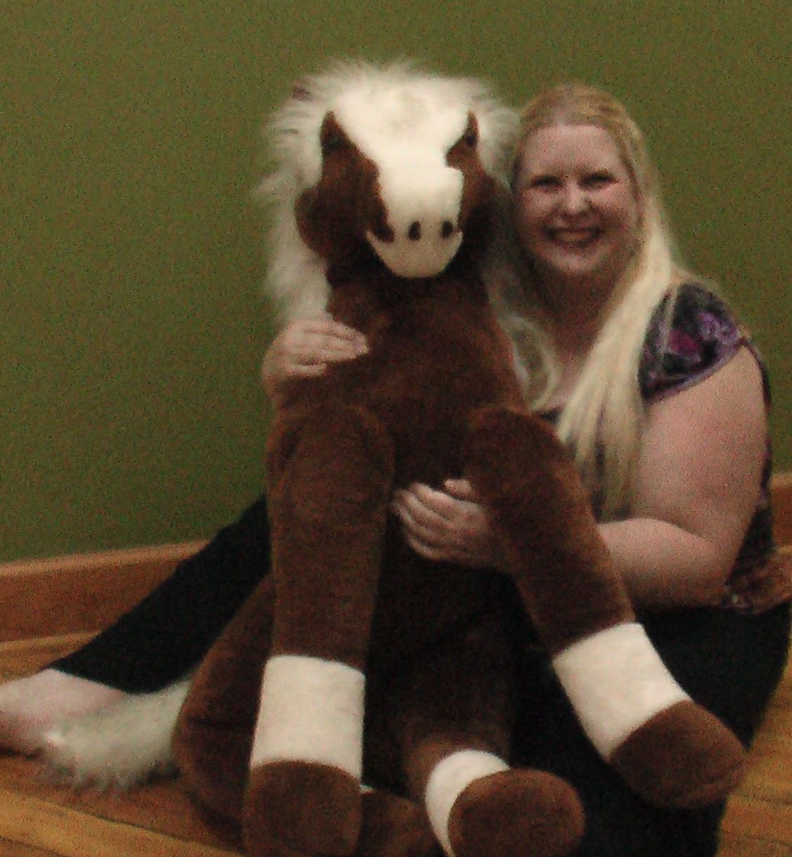 Angela Wiley Holding a Stuffed Animal