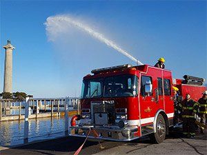 Fire truck spraying water into the air.