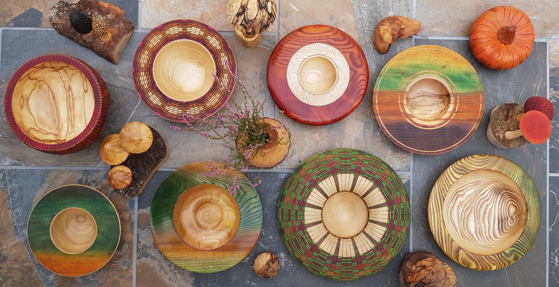 Autumn inspired handmade wooden bowl collection with wooden toadstools, wooden twig pots and pumpkin