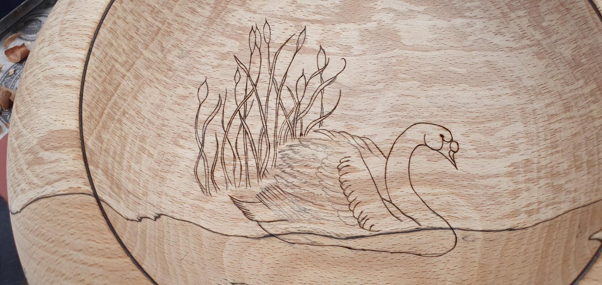 Spalted beech bowl turned by WoodyNess with beginnings of pyrographed swam image