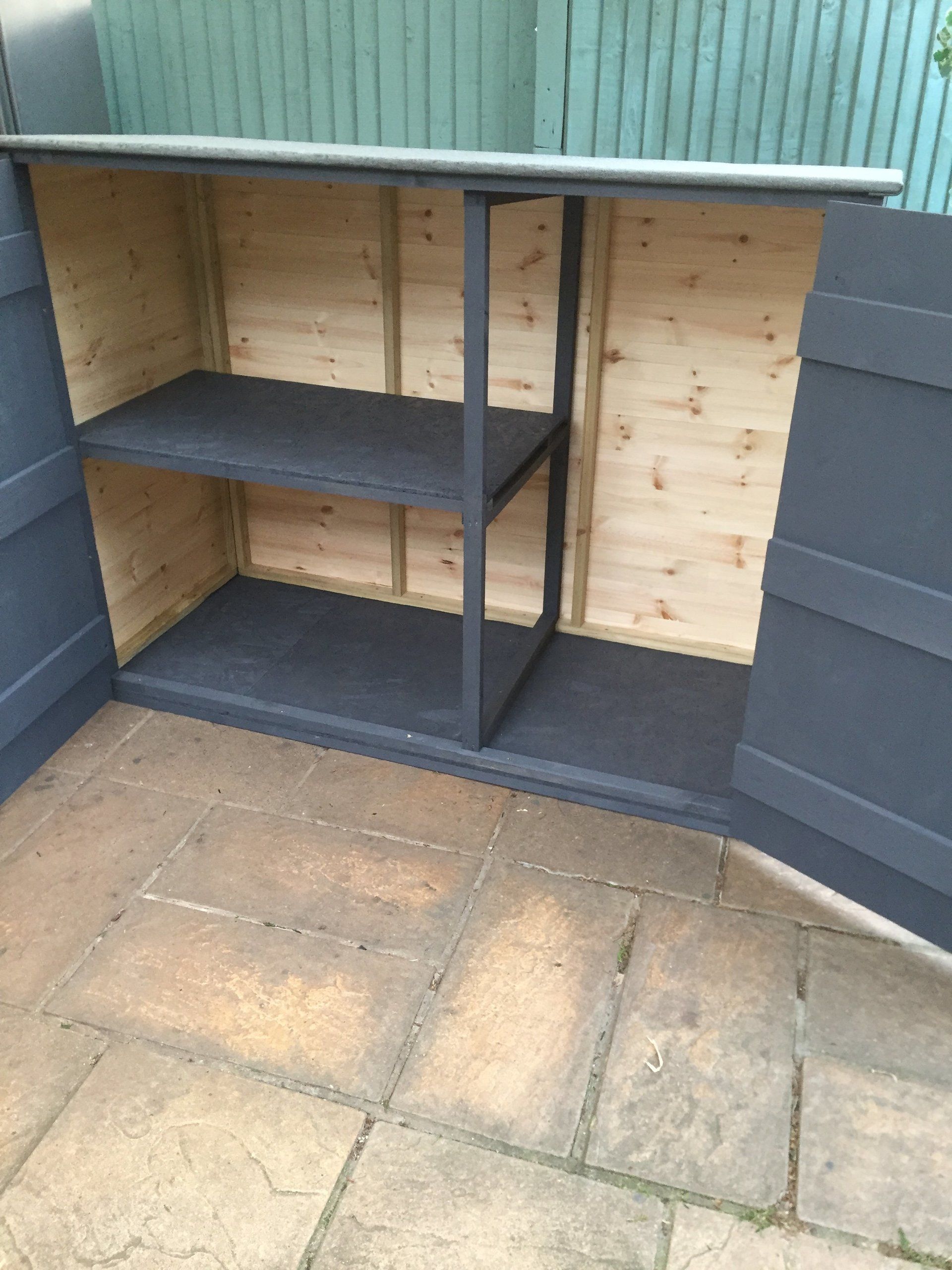 Wheelie bin shed.