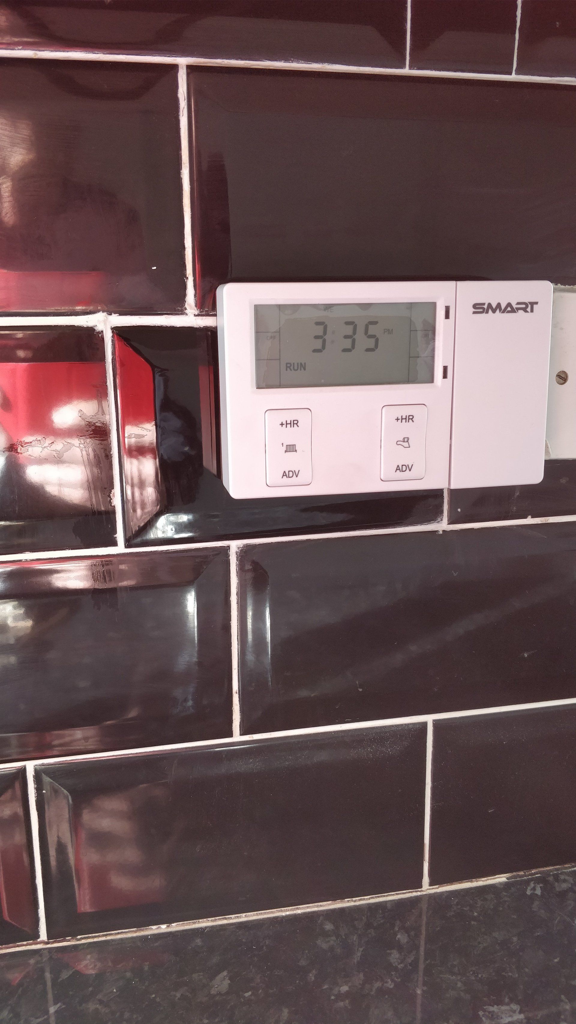 Black tile with white grout New Tile fitted on wall