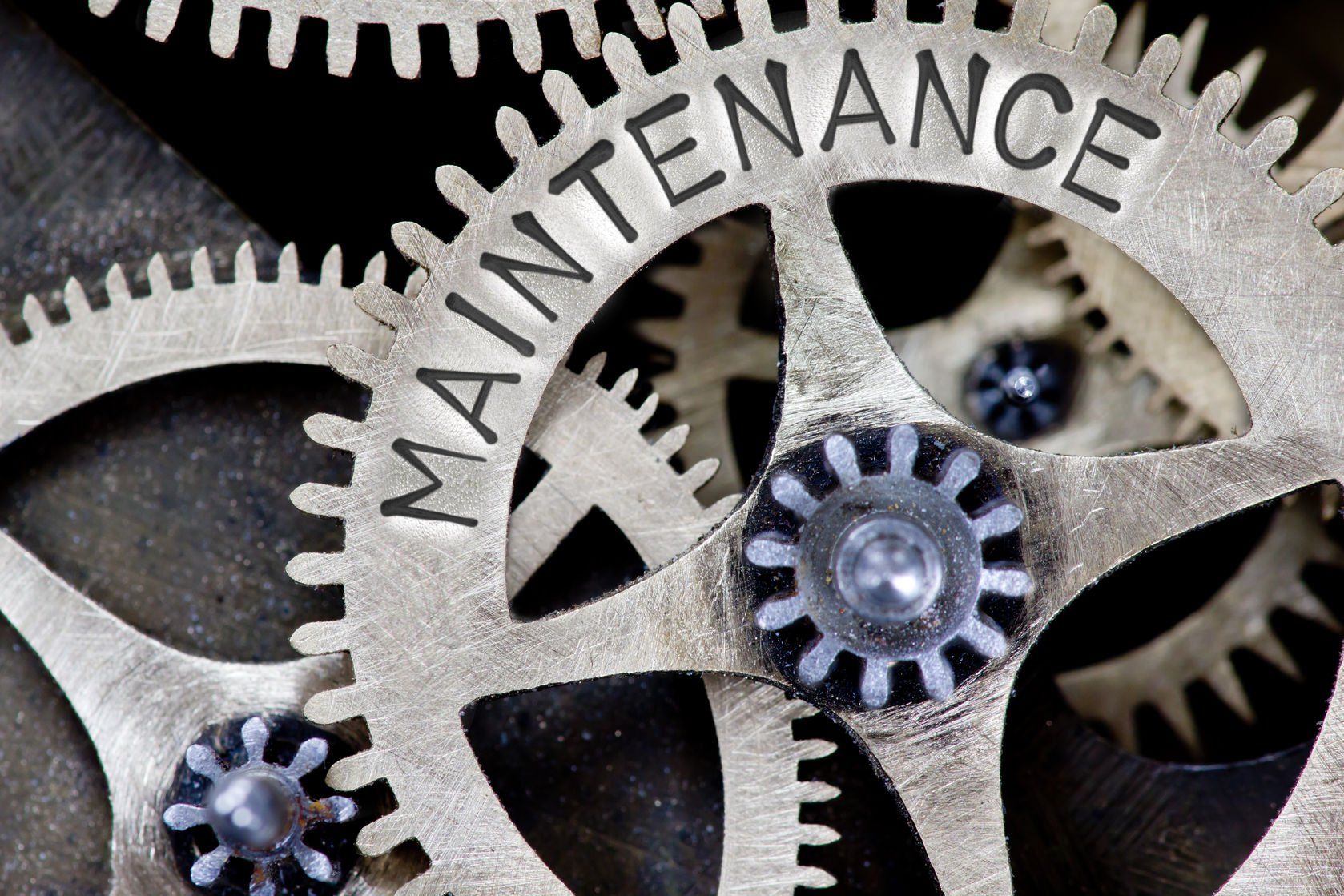 A cog wheel with maintenance written on it
