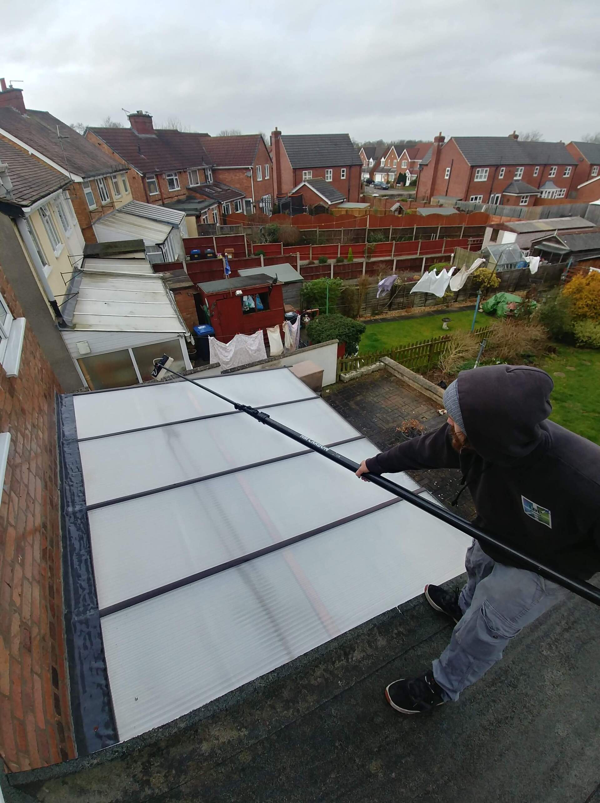 LDP Window Cleaning Ltd staff cleaning a conservatory roof