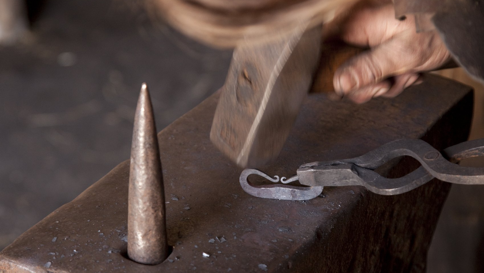 hand hammering steel scrollwork