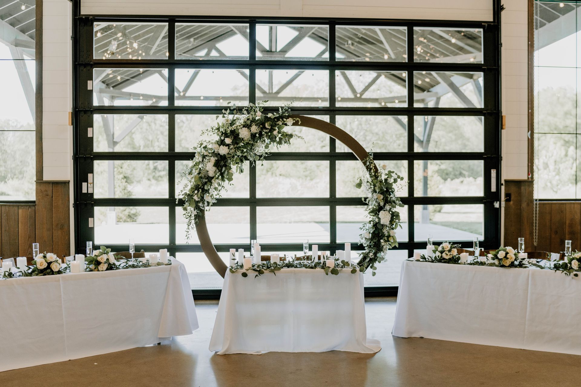 Wedding head table for wedding reception in Fort Wayne with wedding arch