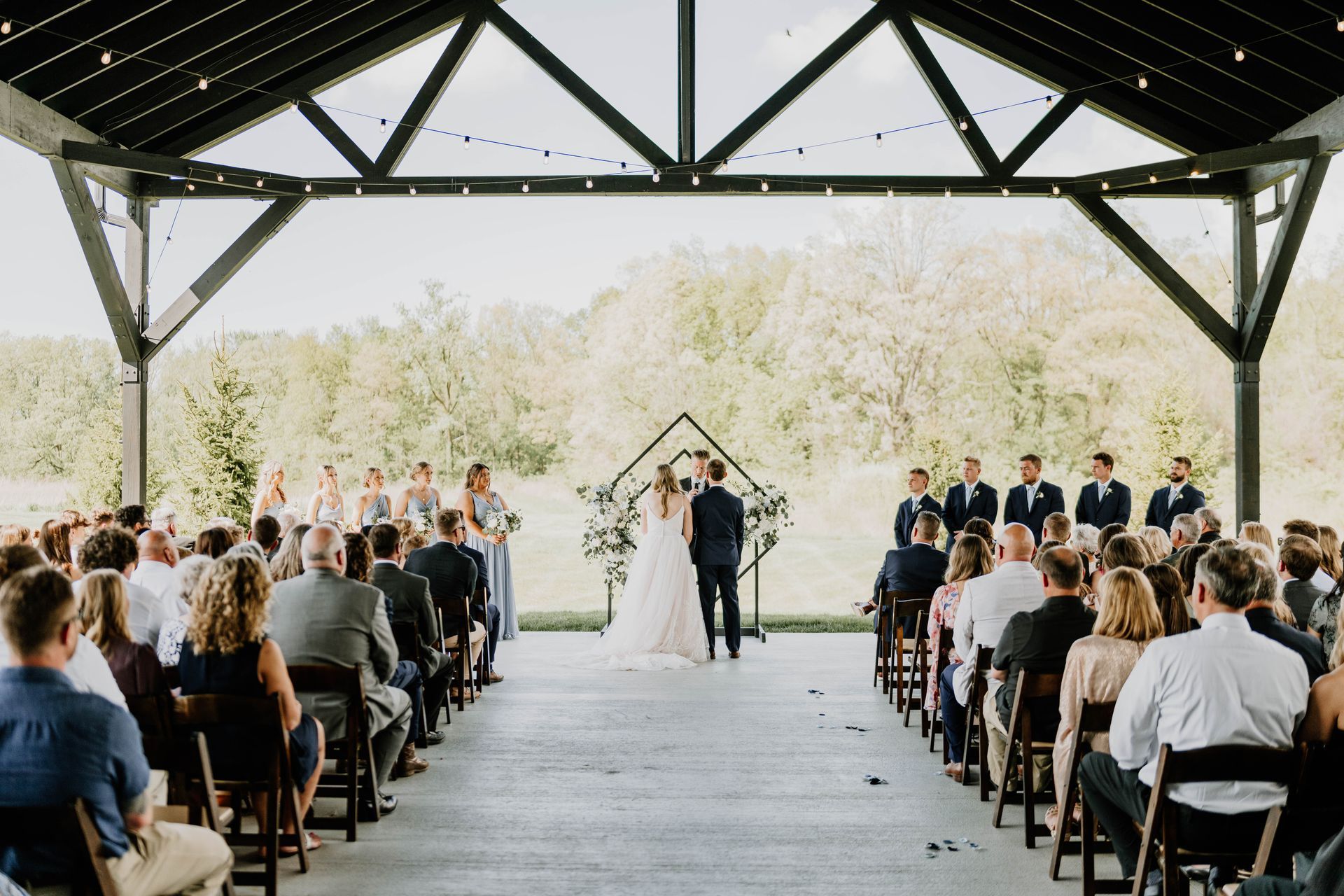 Outdoor wedding ceremony with tree backdrop in country at Union 12 in Fort Wayne Indiana