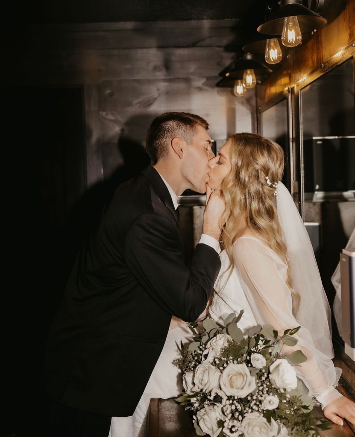 Bride and groom kissing photo at Fort Wayne Wedding Venue