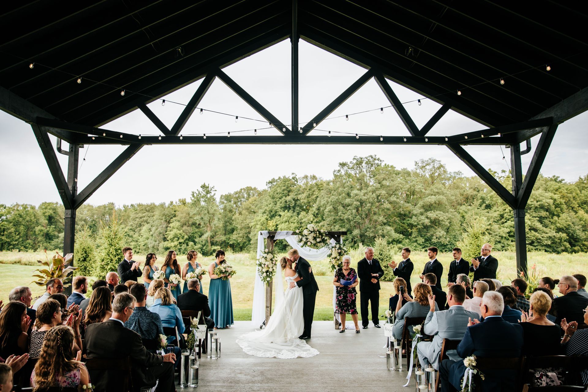 Newlyweds celebrating under the elegant outdoor pavilion at Union 12, perfect for wedding ceremony and reception photos.