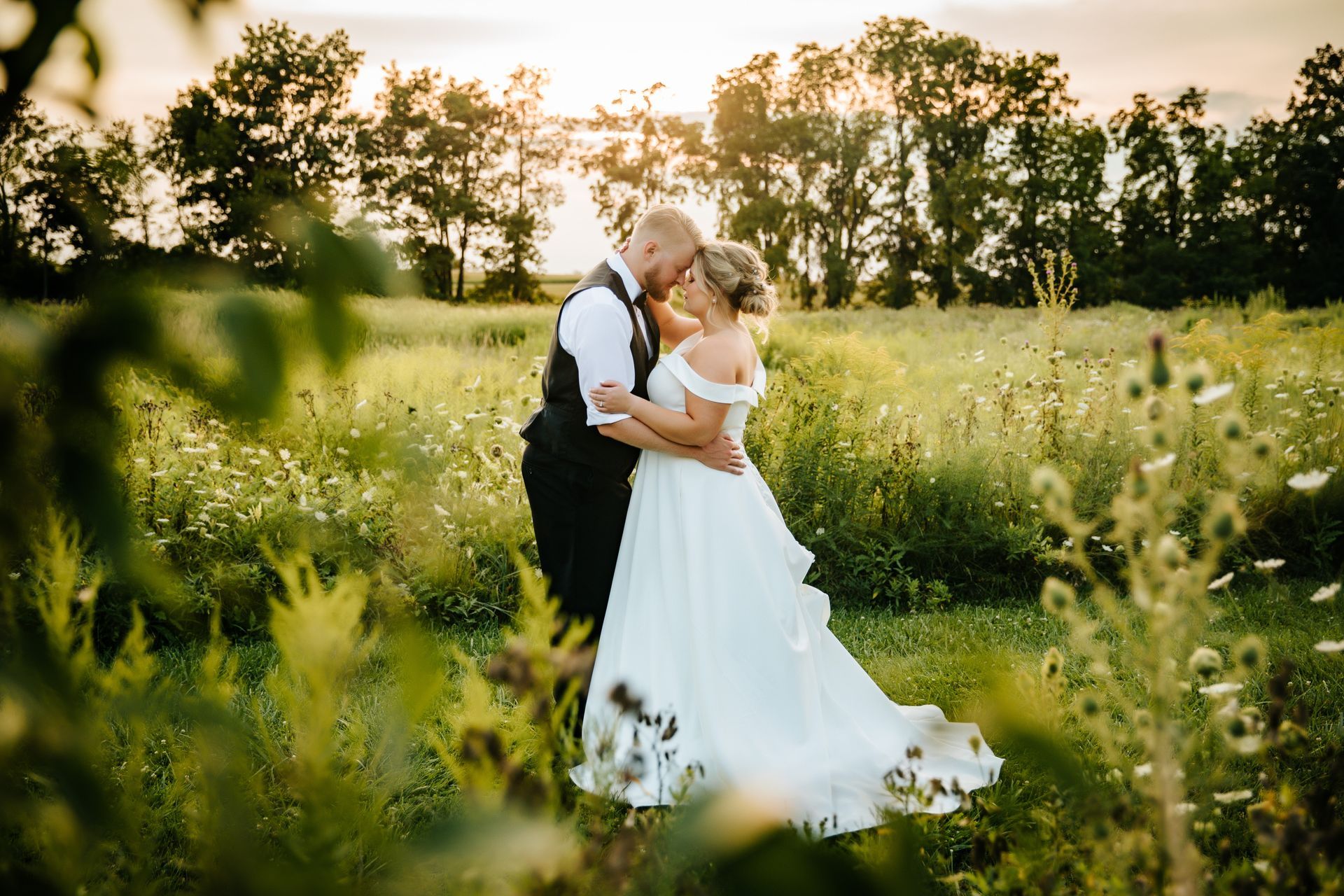 Couple wedding photo in the field at Fort Wayne, Indiana Wedding Venue, Union 12 on their wedding day