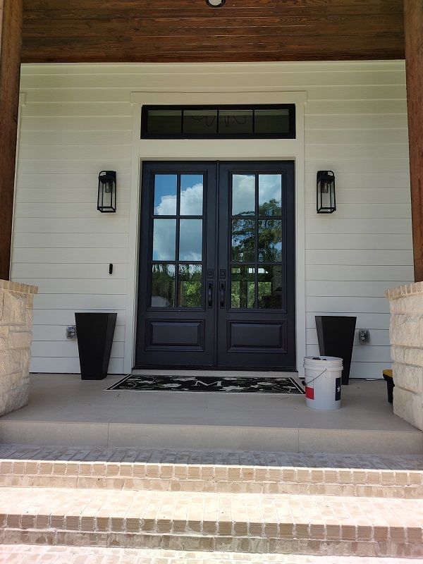 window cleaning double doors with French Pains and a window window above counts as three in Magnolia Texas