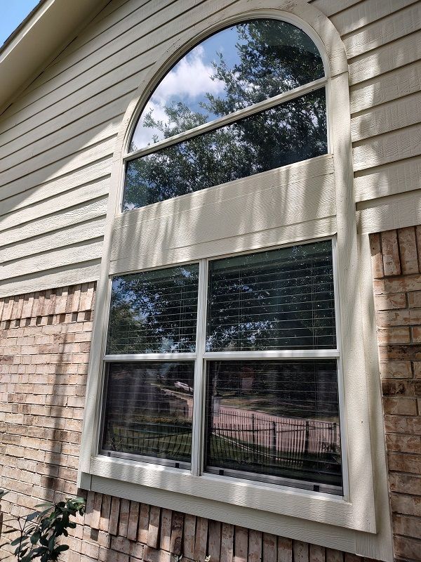 window cleaning two standard windows with split half circle window above
