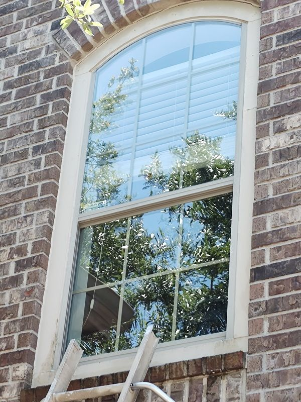 This is a standard double hung with an arch, window example for cleaning count