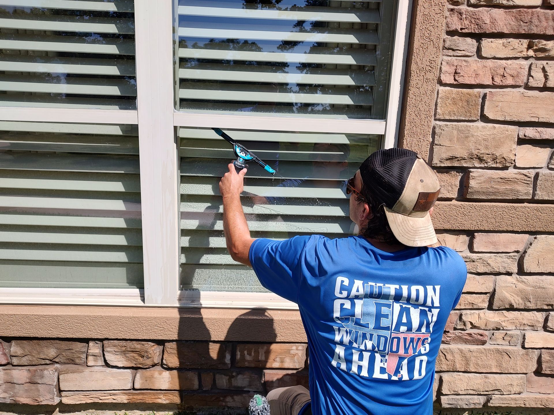 Window Cleaning with a squeegee in Montgomery TX