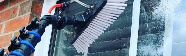 Using a water fed pole can't compete with the clean you get from a mop and squeegee window cleaning in Magnolia Texas