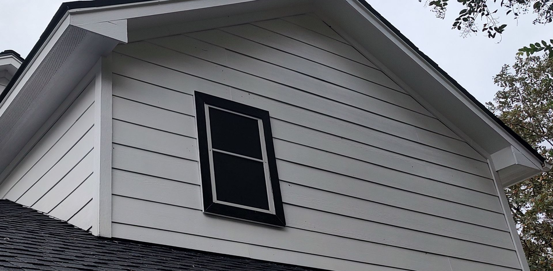 after soft washing this house was white again free of algae making a beautiful transformation.