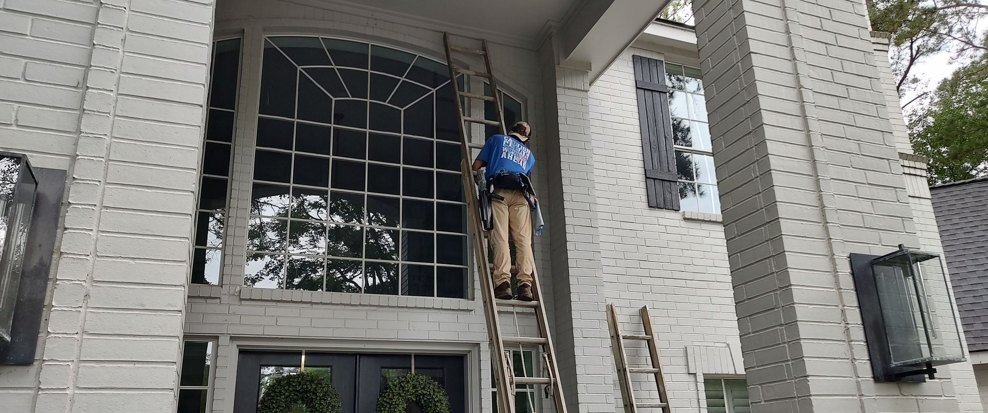 cleaning French pane windows requires a mop and squeegee to get them spotless
