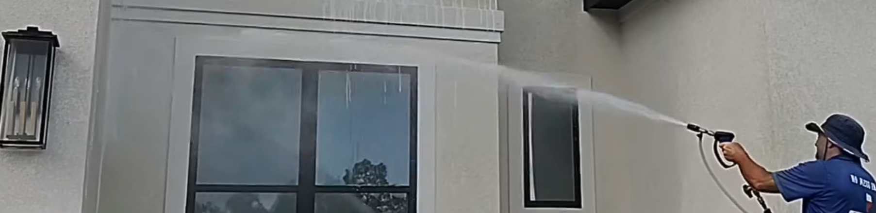 Soft washing stucco home in the Woodlands TX