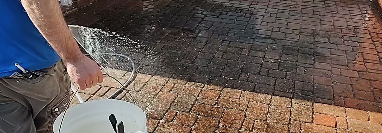 soft washing brick patio pavers because pressure washing would blow away the sand making the bricks unstable.