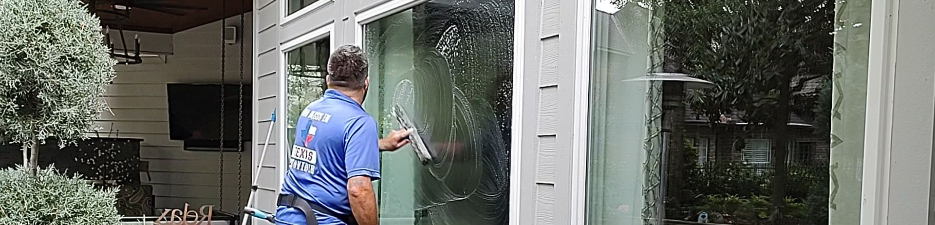 Wetting and pre-scrubbing with a mop when window cleaning in Magnolia TX