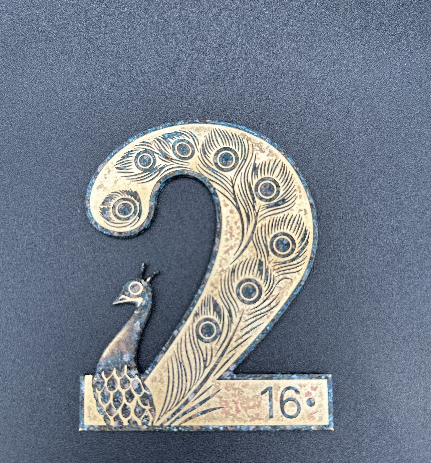 laser cut brass, reverse etched with patina