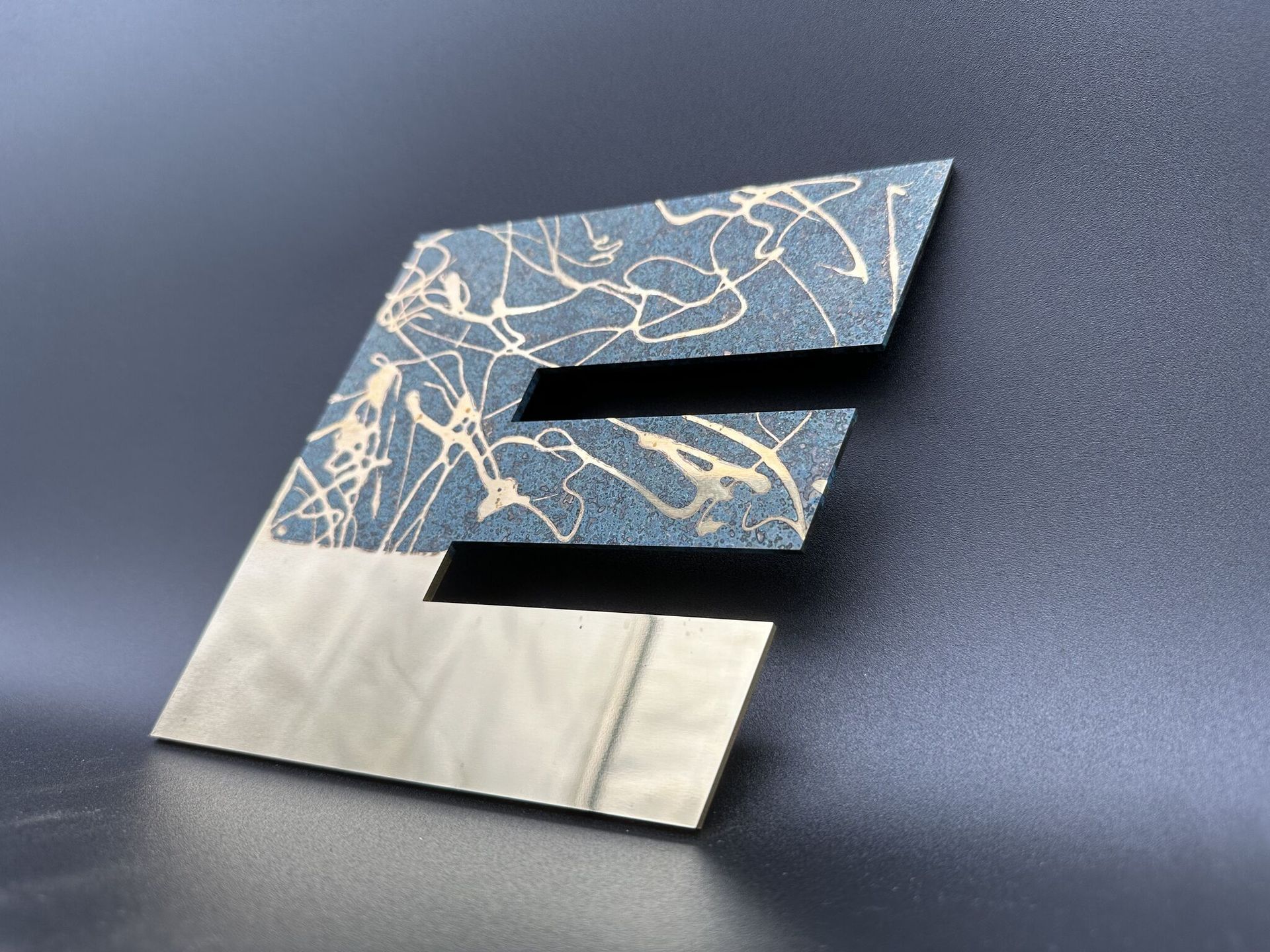 laser cut 3mm polished brass with patina