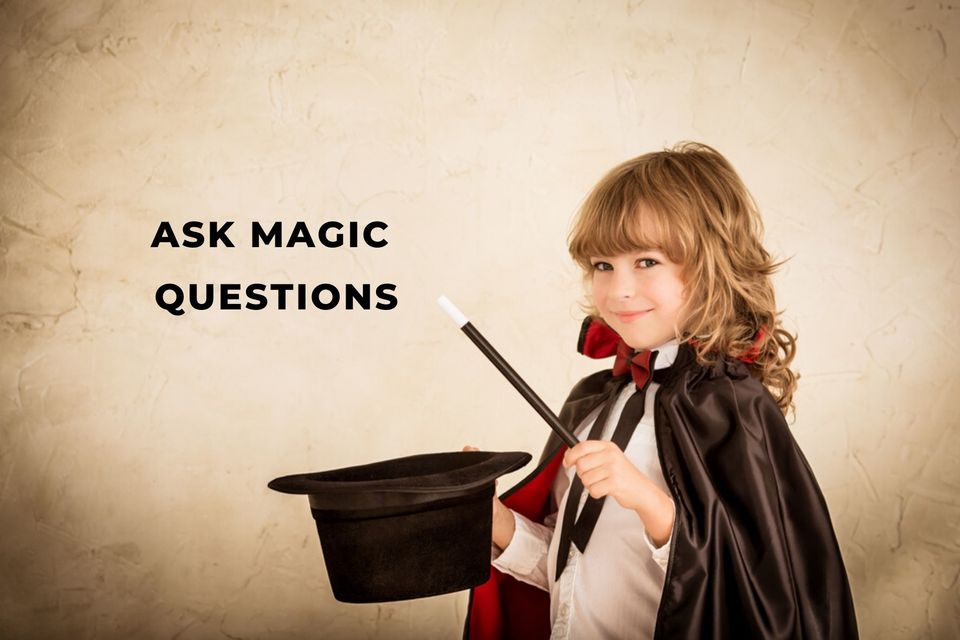 Smiling child holding a magic wand