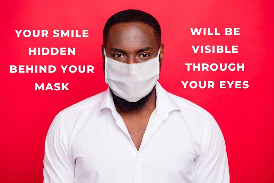 man wearing a mask with smily eyes