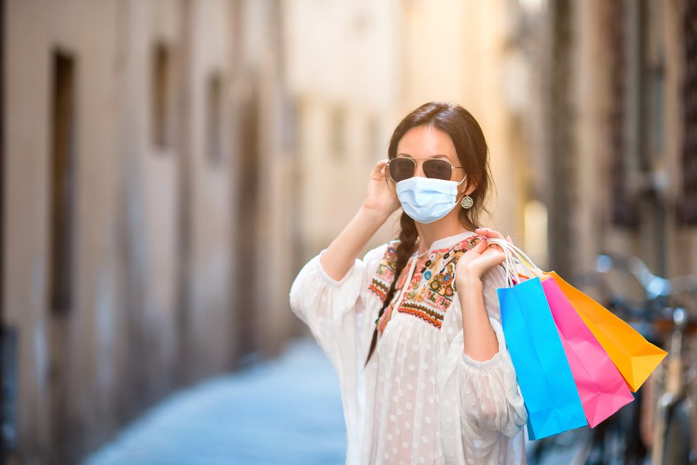 woman doing shopping with a mask on