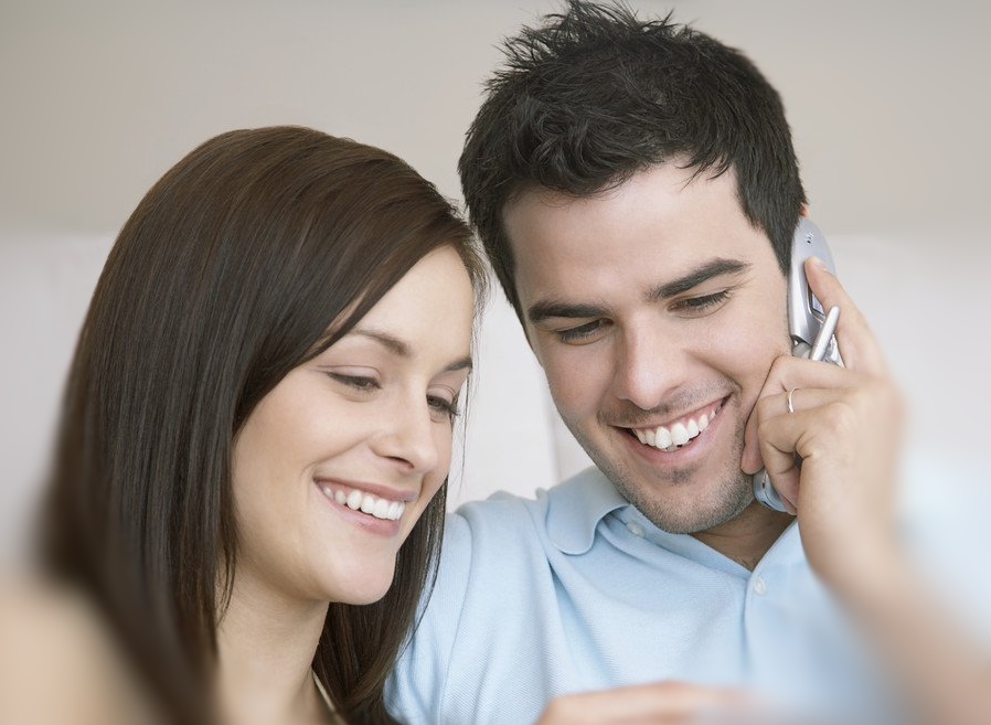 Young couple happy on the phone