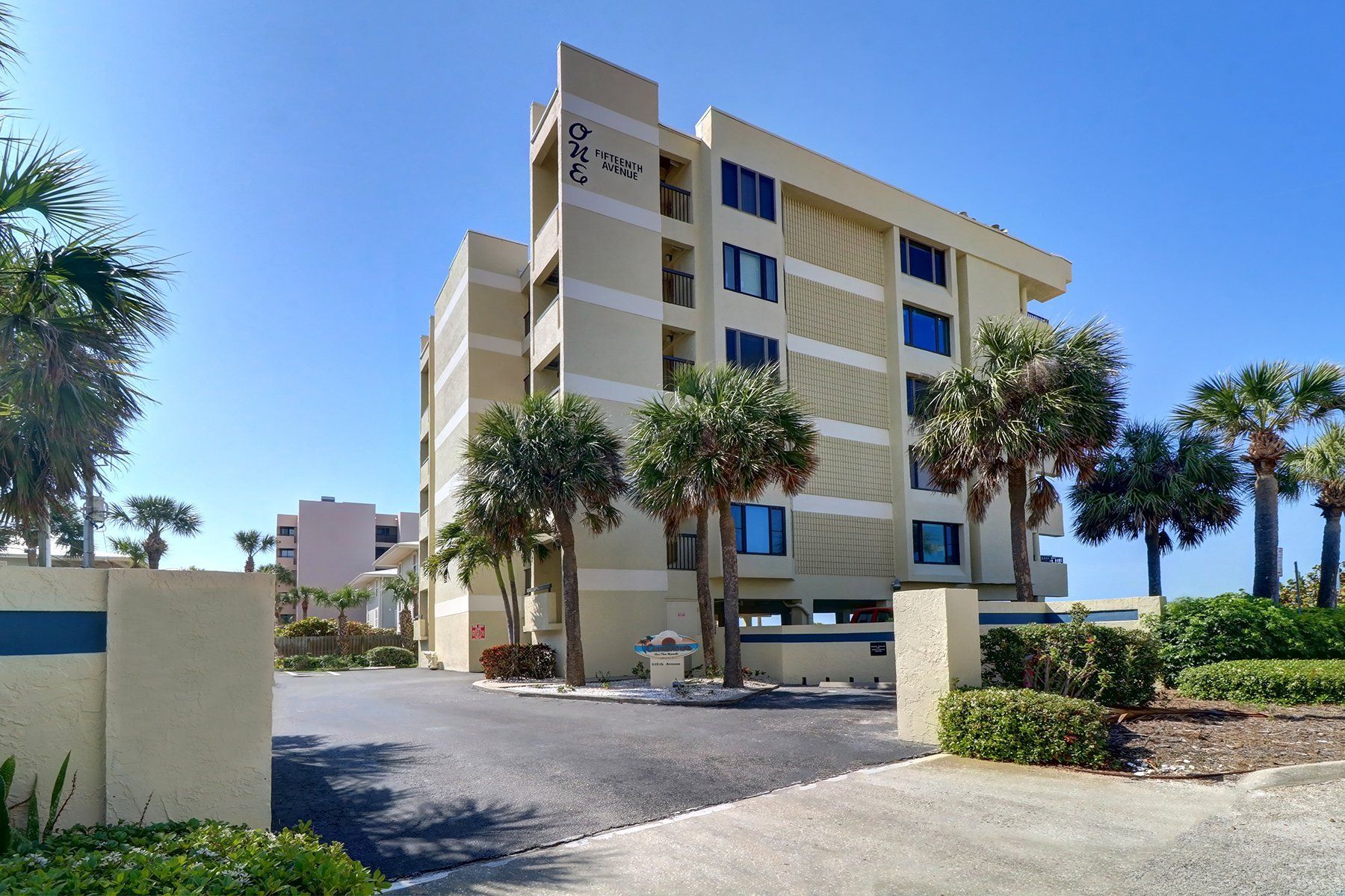 Casablanca Condo building Condo Building with palm trees and driveway