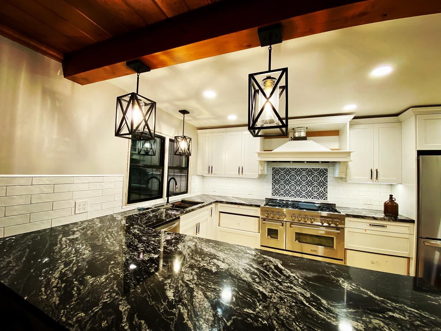 Modern kitchen lighting upgrade in Morrisville, NC, pendant lights over the island and recessed dimmable ceiling lighting