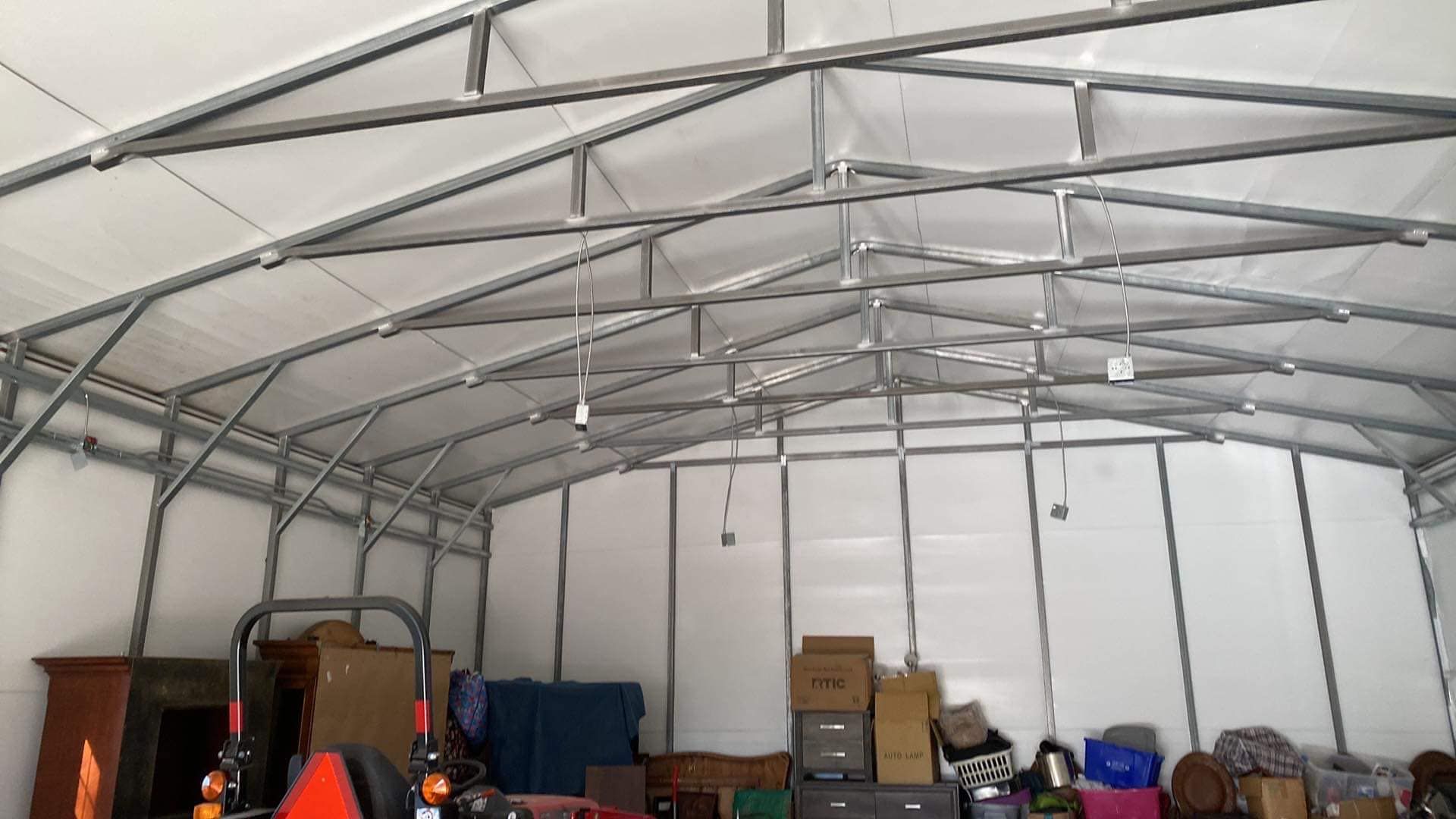 Electrical wiring in a detached storage workshop shed in Youngsville, NC, conduit, outlets, and lighting for workspace.