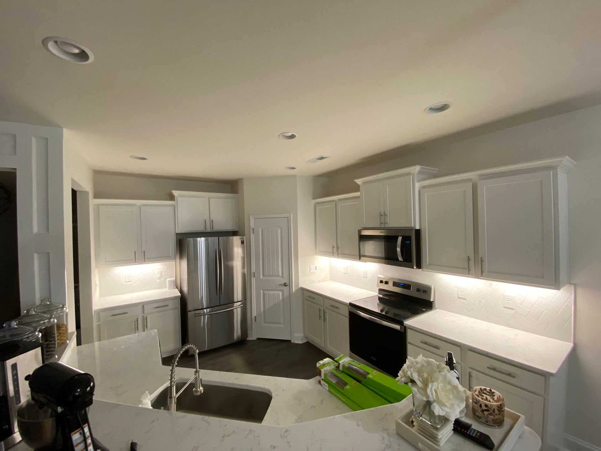 Under cabinet lighting installation with professional wiring in Durham NC kitchen by All Wired Up NC