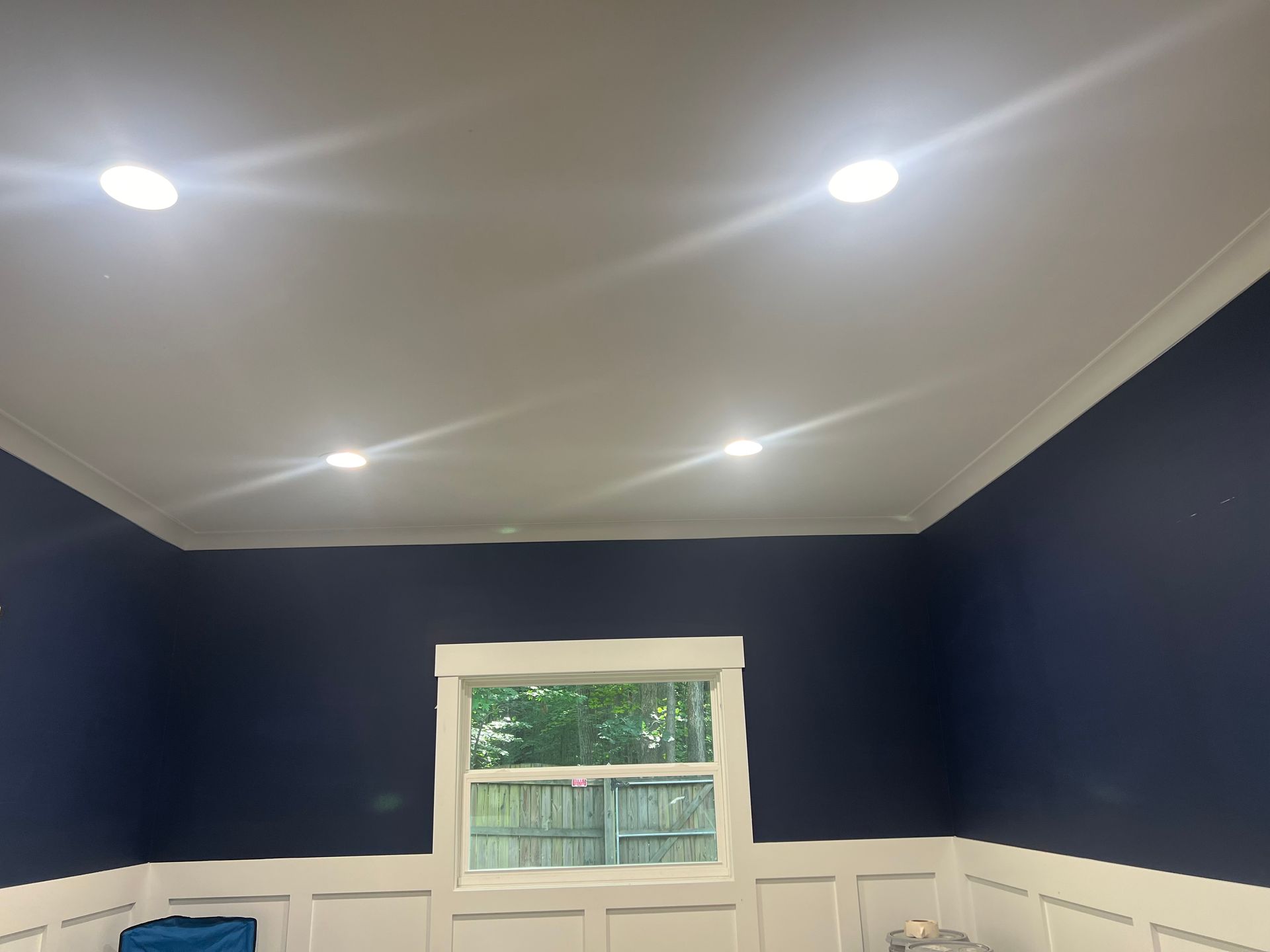 Recessed LED lighting installation in a navy blue home office with crown molding – Raleigh, NC